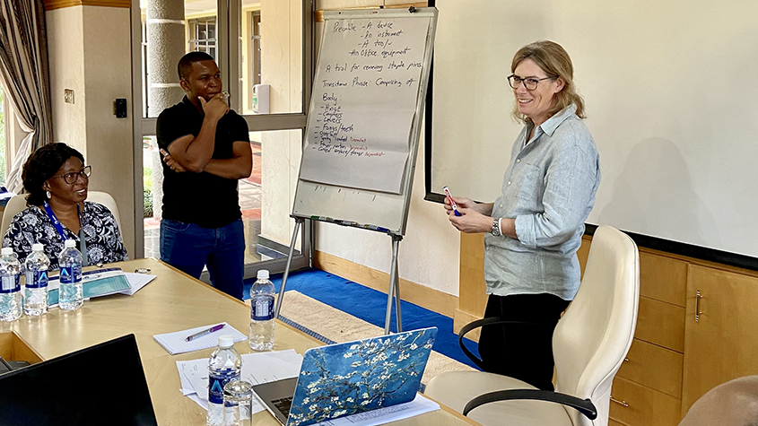 Photo of Ms. Anna Tomlinson guiding participants through an exercise.